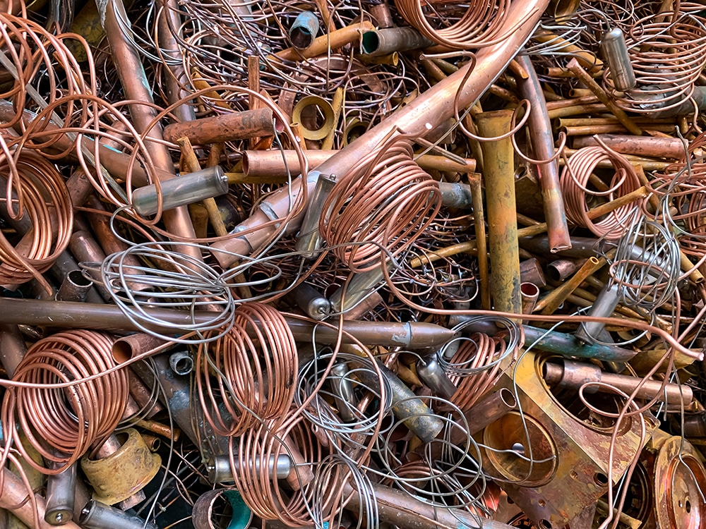 Copper scrap tubes and wire ready to be recycled, portrait view